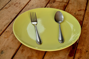 Empty dinner plate front view on wood  background