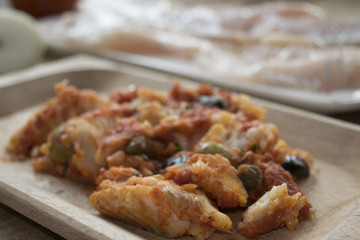 cod with olives capers and tomato sauce