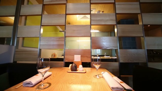partition and table appointments in cafe with modern interior