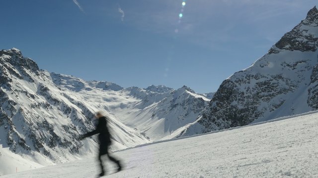 Skier and snowboarder piste mountain massiv background