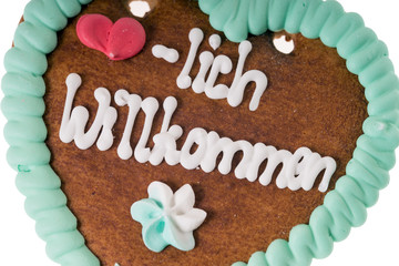 Lebkuchenherz mit den Worten Herzlich Willkommen
