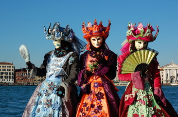 Fototapeta na wymiar Group of people in costumes and masks, Venice carnival
