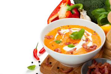 Carrot sweet pepper cream soup with bacon