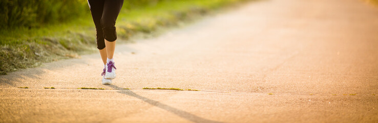 Male athlete/runner running on road