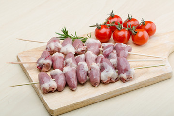 Raw chicken hearts for barbecue