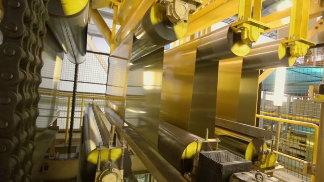 Aluminum sheets are rolled on machine tool of rolling mill