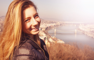 Cute teenage girl enjoy city view.