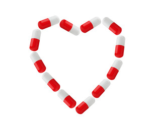 Pills as heart symbol isolated on white