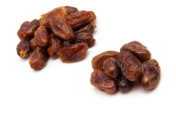 Medjool dates isolated on a white background.