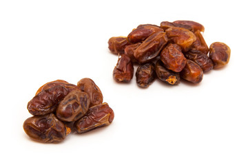 Medjool dates isolated on a white background.
