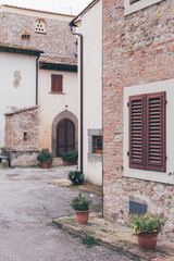 Fototapeta na wymiar detail of a italian house with flowers on the porch