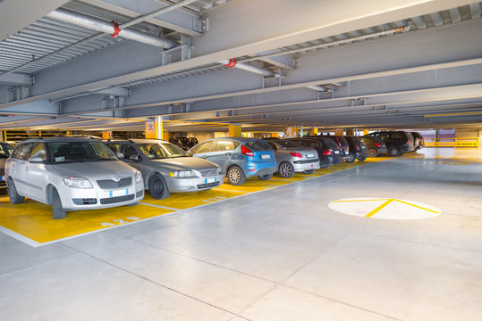 Parking garage, interior with a parked cars