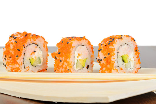 Closeup of three California maki sushi in row