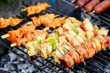 Assorted meat and vegetables on barbecue grill