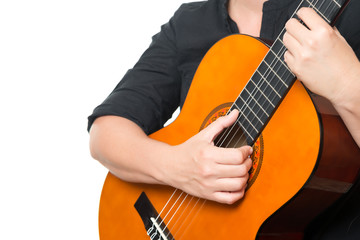 Female hands playing an acoustic guitar