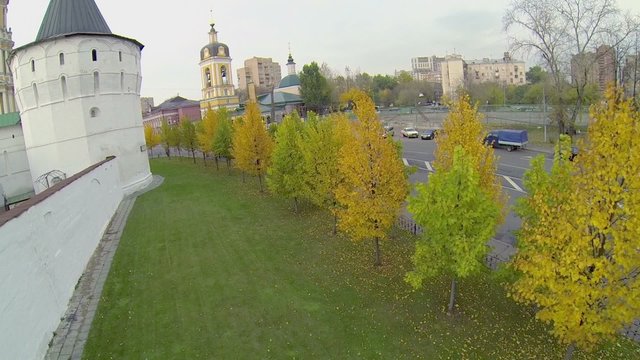 Car rides by road near Monastery and church