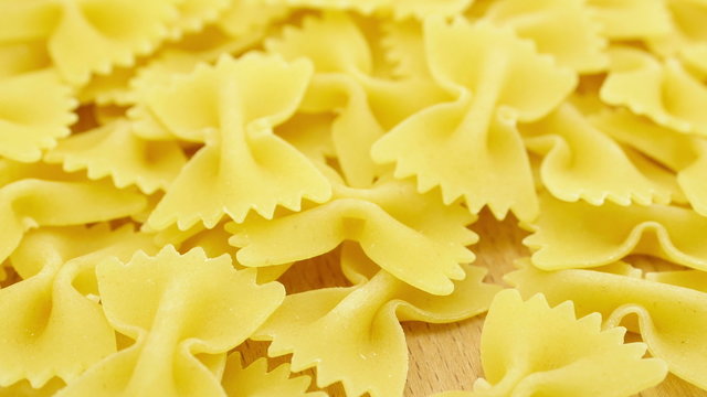 Farfalle - bow shaped pasta background in 4K UHD