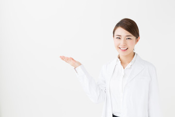 Fototapeta premium young asian doctor on white background