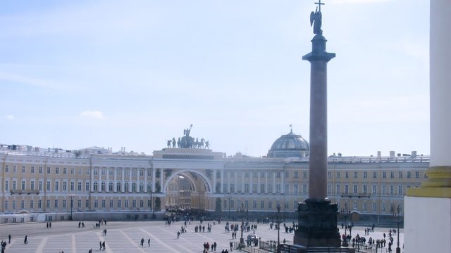 Tourists walking in Palace square in front of hermitage in Sankt Petersburg, on Apr 06, 2013 in Sankt Petersburg, Russia.