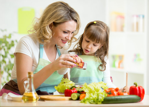 Mother With Kid Make Salad