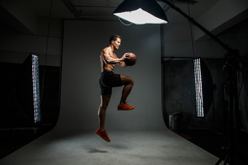Fototapeta premium Guy with basket ball in action