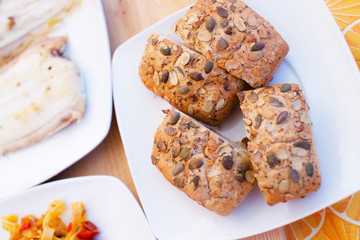 Slices of delicious brown bread on a white plate