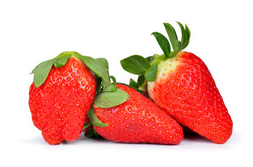 Three strawberries close up on white background