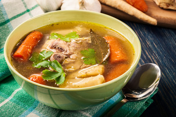 Chicken broth with noodles and carrot