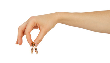 Female hand holding wedding rings