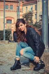 Beautiful girl posing in an urban context