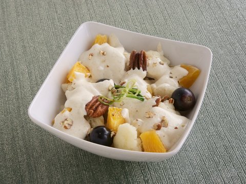 vegetable salad with calliflower,orange,olives and maionese