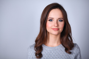 Fototapeta premium Portrait of an attractive fashionable young brunette woman