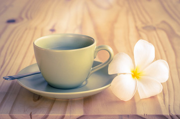Fototapeta na wymiar Hot milk green tea in cup with vintage filter