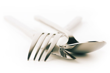 Fork, spoon and knife on white