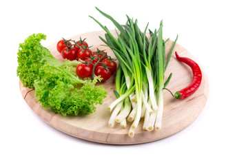 Bunch of green onion with red pepper