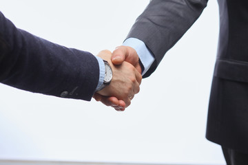 Closeup of a business handshake, on white background