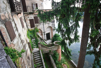 Beauty building on the bluff above the river in Italy