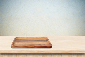 Blank wood tray on table background