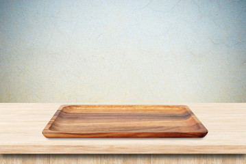 Blank wood tray on table background