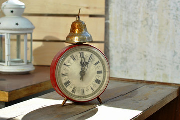 Vintage clock on the old table 
