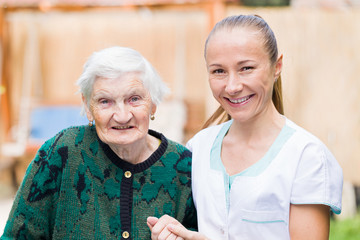 Elderly woman with caregiver