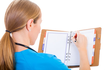 Young doctor writing report