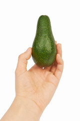 Avocado in hand isolated on white background