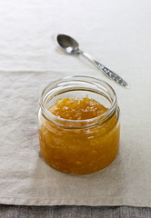 jar with  jam on a linen napkin
