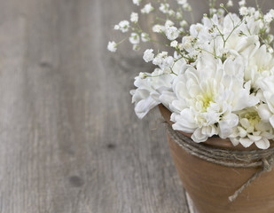 bouquet of white chrysanthemums in a ceramic pot