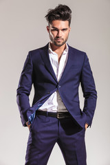 Fototapeta premium business man holding both hands in his pocket