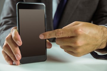 Businessman showing his smart phone