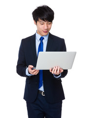 Young business man using laptop