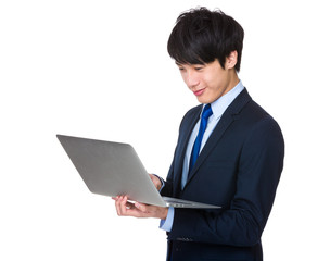 Young business man using notebook