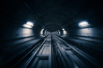 Subway tunnel and blurred light trails